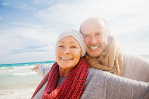 Older couple enjoying the beach together after successful cataract surgery.