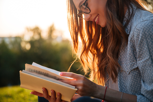 Women reading book before LASIK surgery