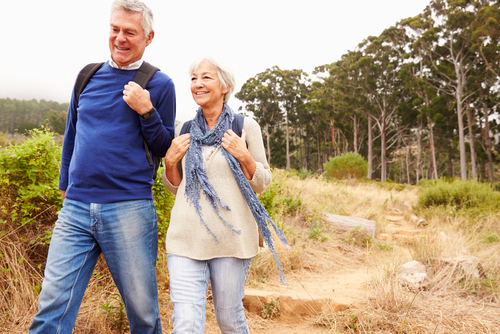 Elderly couple walking in the woods