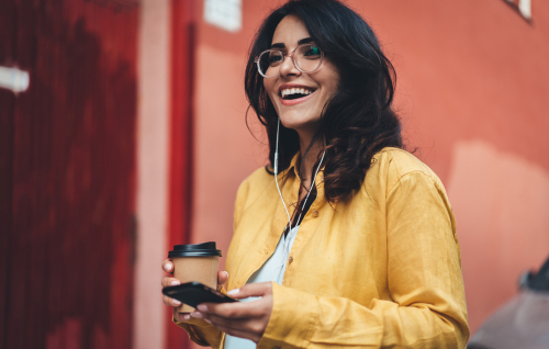 Young woman with glasses smiling before LASIK eye surgery