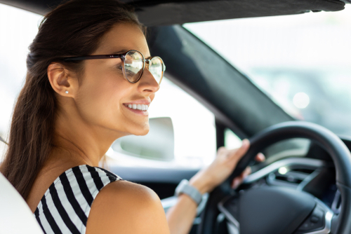 Woman with eyeglasses driving