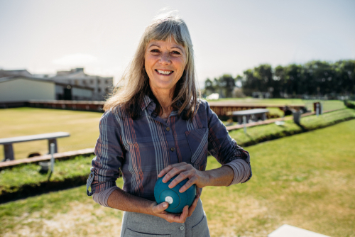 Woman with diabetic retinopathy playing bocce