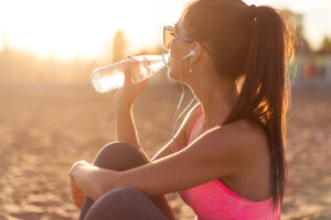 woman drinking water bottle