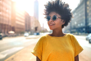 smiling woman wearing sunglasses 