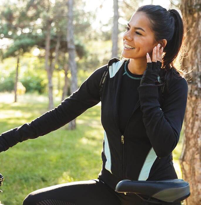 Woman Smiling on Bike