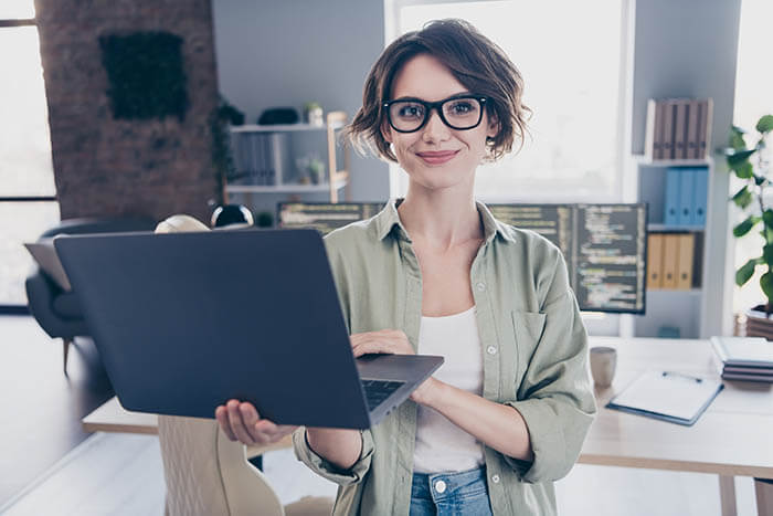 Smiling Woman Holding Her Laptop Computer